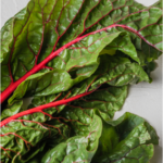 Swiss Chard on beige background